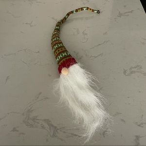 Christmas wine bottle decoration with jingle bell at top